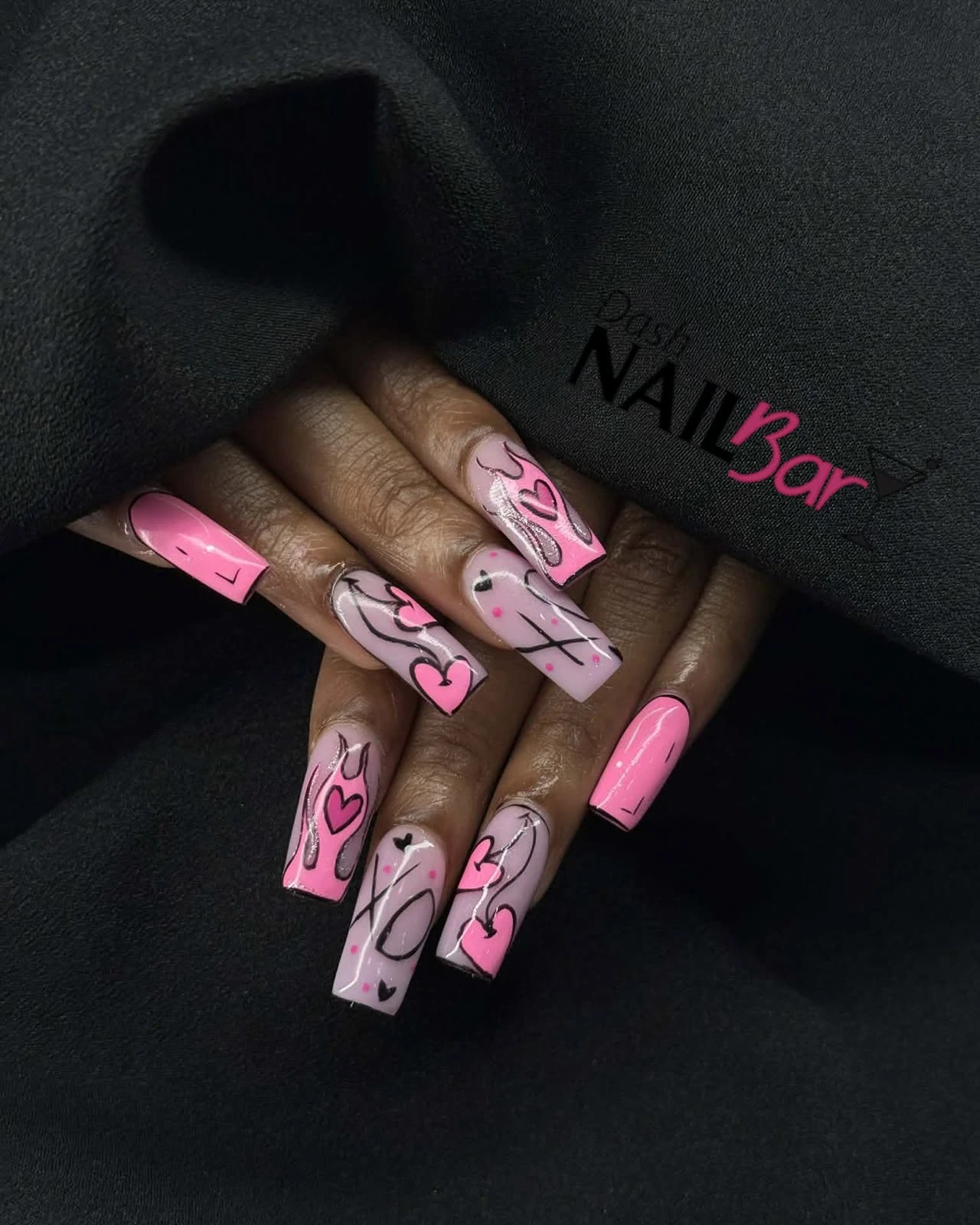 Pink statement nail art featured on the Dash Facebook page