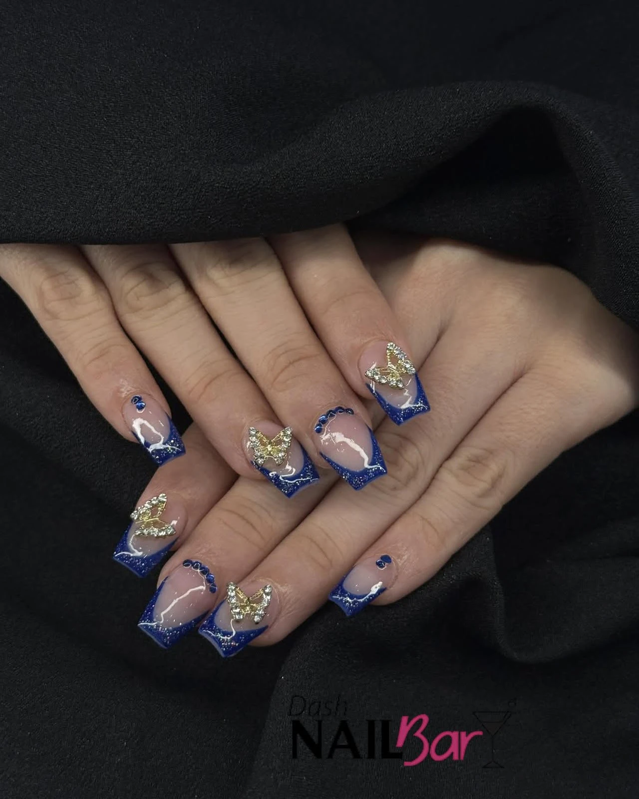 Blue French tips with butterfly details from the Dash Facebook page